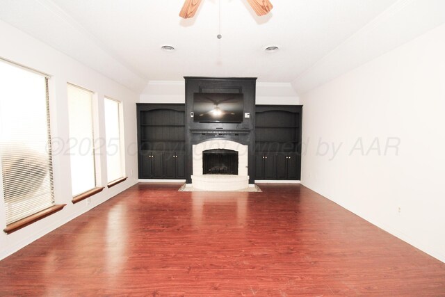 6108 Belpree Rd, Amarillo, TX 79106 - unfurnished living room with a fireplace with raised hearth, wood finished floors, a ceiling fan, and crown molding