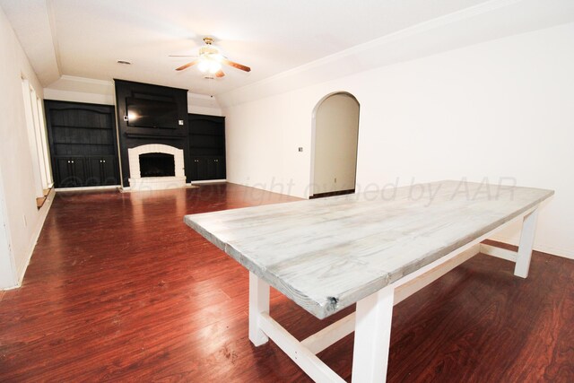 6108 Belpree Rd, Amarillo, TX 79106 - dining space featuring ceiling fan, wood finished floors, a large fireplace, and crown molding
