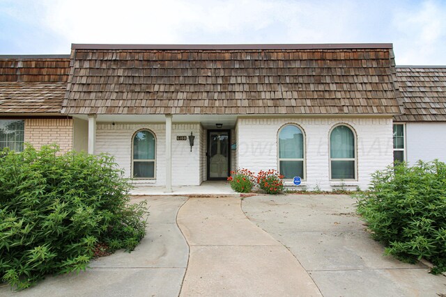 6108 Belpree Rd, Amarillo, TX 79106 - view of front of property featuring brick siding and mansard roof