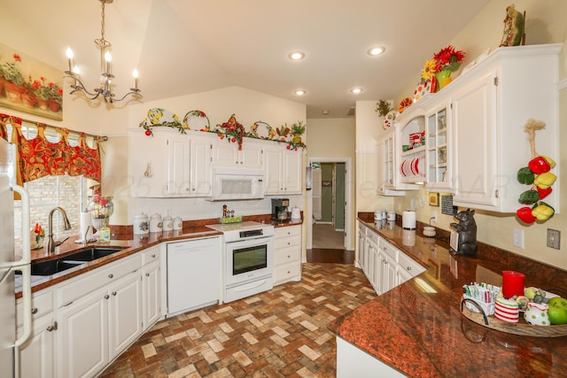 5809 Foxcroft Dr, Amarillo, TX 79109 - kitchen featuring white appliances, a sink, brick floors, dark countertops, and white cabinets