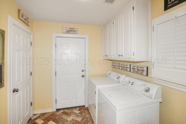 5809 Foxcroft Dr, Amarillo, TX 79109 - laundry area with washing machine and clothes dryer, baseboards, and cabinet space