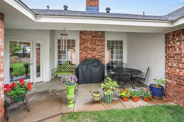 5809 Foxcroft Dr, Amarillo, TX 79109 - view of patio featuring a grill and outdoor dining space