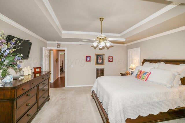 5809 Foxcroft Dr, Amarillo, TX 79109 - bedroom with a tray ceiling, light colored carpet, ornamental molding, ceiling fan, and baseboards