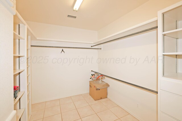 18 Didrickson Ln, Amarillo, TX 79124 - spacious closet featuring light tile patterned floors