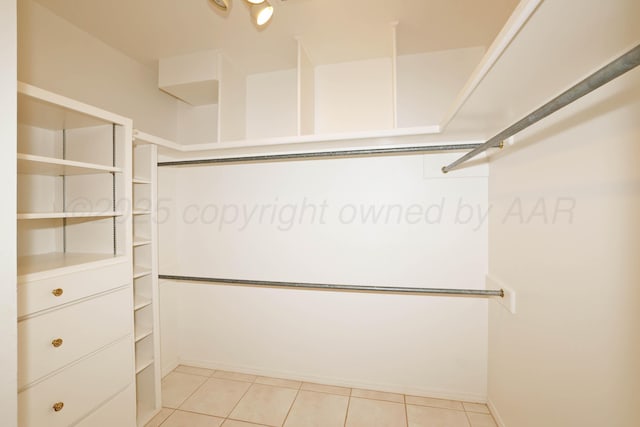 18 Didrickson Ln, Amarillo, TX 79124 - spacious closet featuring light tile patterned flooring