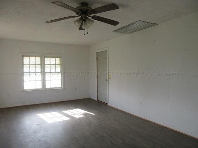 413 N Bowie Ave, Tulia, TX 79088 - spare room with ceiling fan and baseboards
