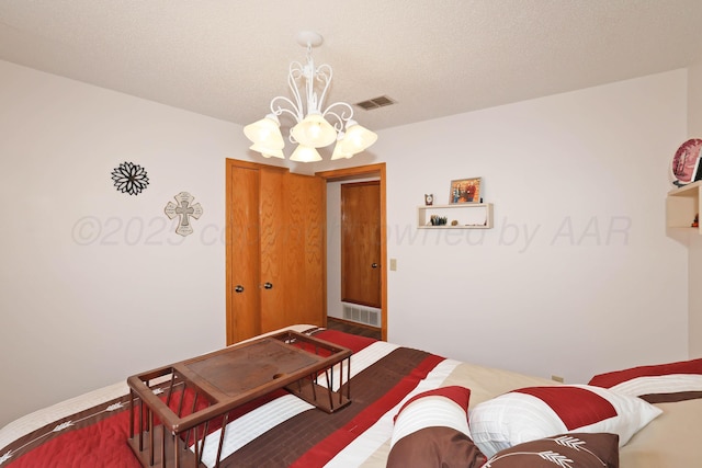 bedroom with a chandelier