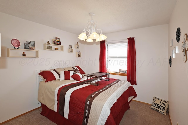 carpeted bedroom featuring a chandelier and baseboards