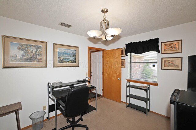 office space with a chandelier, a textured ceiling, baseboards, and light colored carpet