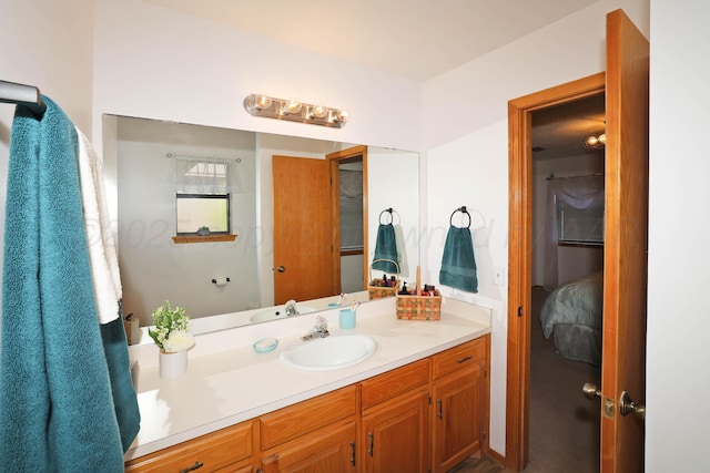 bathroom with vanity and connected bathroom