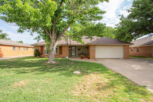 6010 Calumet Rd, Amarillo, TX 79106 - ranch-style home with an attached garage, concrete driveway, a front lawn, brick siding, and roof with shingles