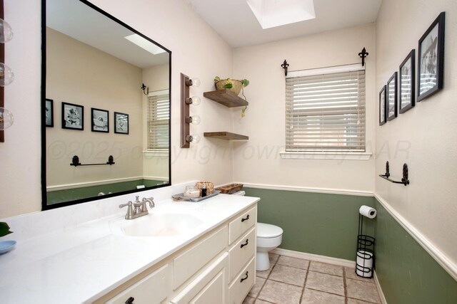 6010 Calumet Rd, Amarillo, TX 79106 - bathroom with vanity, a skylight, and tile patterned floors