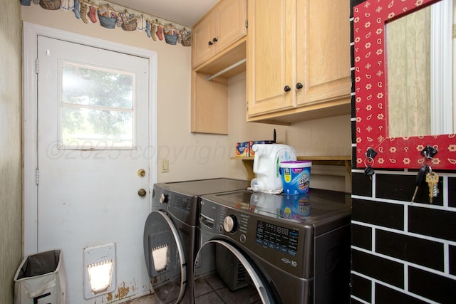6010 Calumet Rd, Amarillo, TX 79106 - laundry room with separate washer and dryer, cabinet space, and tile patterned floors