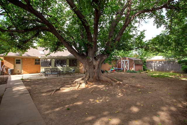 6010 Calumet Rd, Amarillo, TX 79106 - view of yard with a storage shed and a patio
