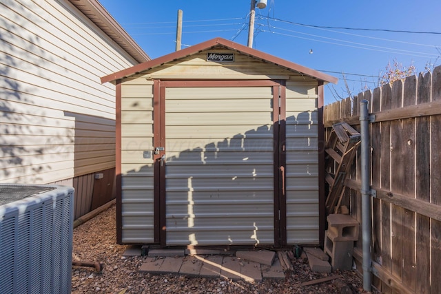 view of outbuilding with cooling unit