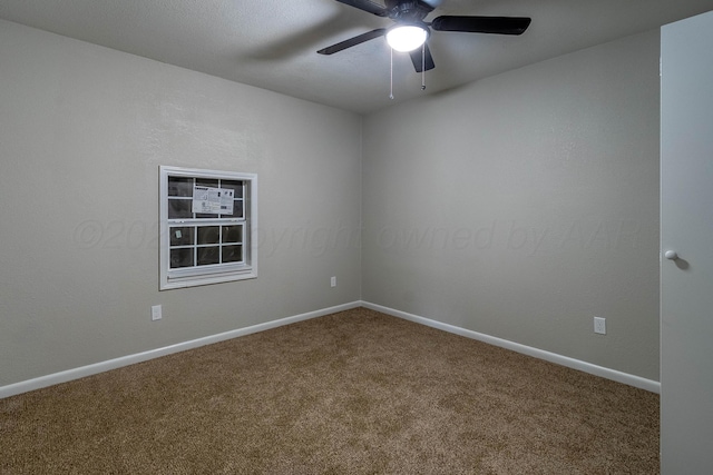 spare room featuring carpet floors and ceiling fan