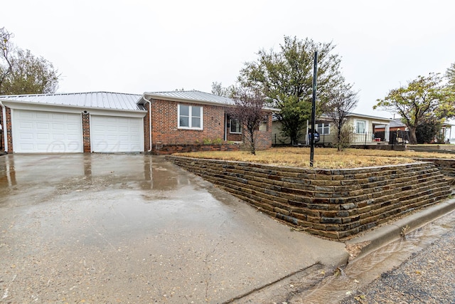 ranch-style home featuring a garage