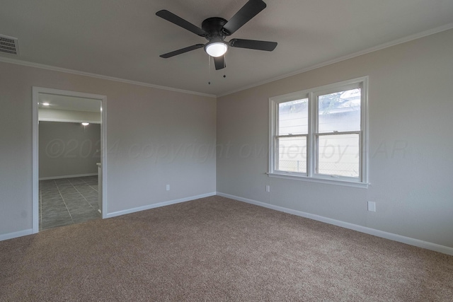 spare room with ceiling fan, carpet floors, and ornamental molding