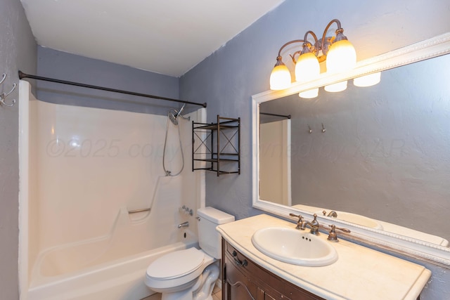 bathroom with toilet, shower / washtub combination, and vanity