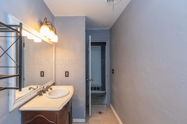 bathroom featuring tile patterned floors, visible vents, vanity, and baseboards