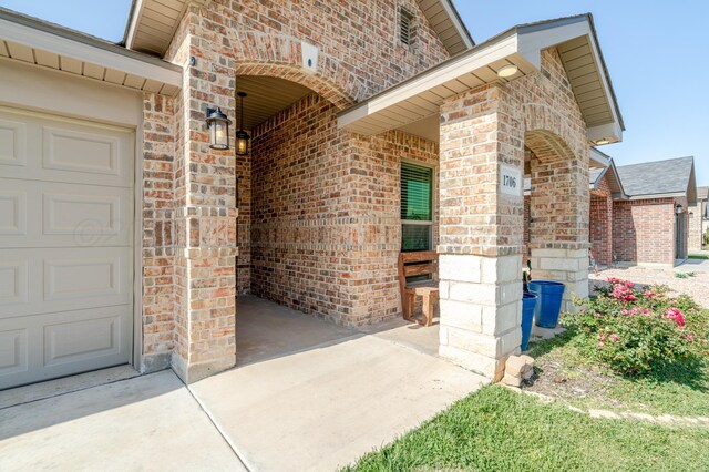 1706 Morningside Ave, Amarillo, TX 79118 - doorway to property featuring brick siding and driveway