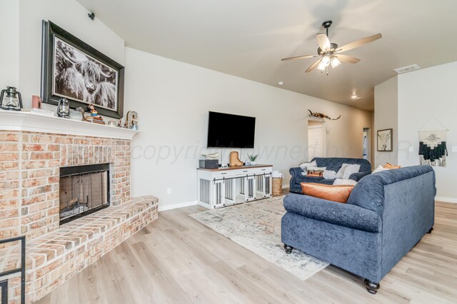 1706 Morningside Ave, Amarillo, TX 79118 - living room with wood finished floors, ceiling fan, lofted ceiling, and a brick fireplace