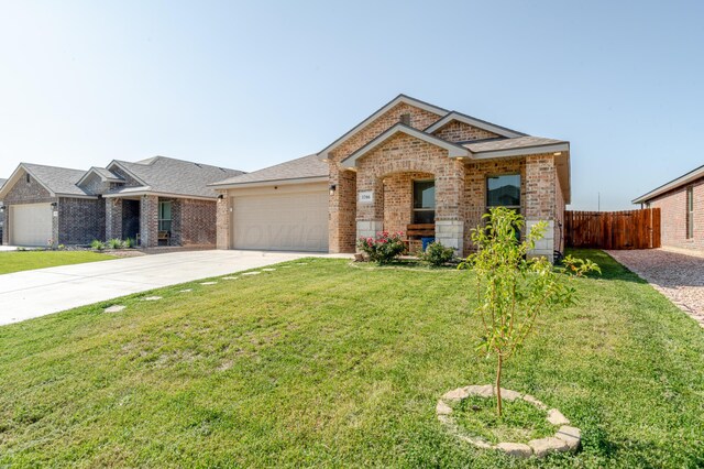 1706 Morningside Ave, Amarillo, TX 79118 - view of front of home with brick siding, driveway, an attached garage, and roof with shingles