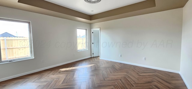 unfurnished room featuring parquet floors