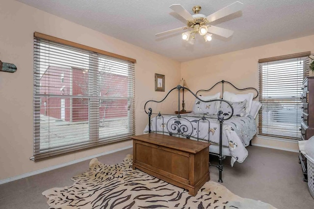 1513 S Girl Scout Rd, Amarillo, TX 79124 - bedroom featuring carpet, baseboards, ceiling fan, and a textured ceiling