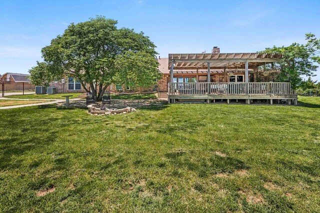 1513 S Girl Scout Rd, Amarillo, TX 79124 - rear view of property featuring a pergola, a yard, a deck, and central air condition unit