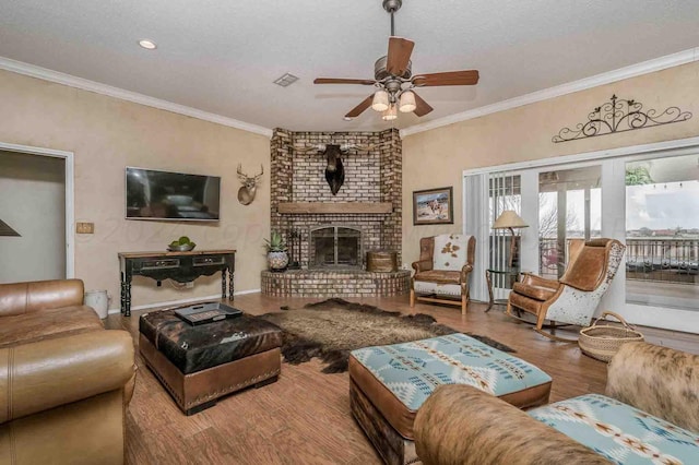 1513 S Girl Scout Rd, Amarillo, TX 79124 - living room featuring a ceiling fan, wood finished floors, a brick fireplace, ornamental molding, and recessed lighting