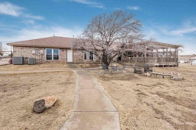 1513 S Girl Scout Rd, Amarillo, TX 79124 - back of house featuring brick siding, central air condition unit, and roof with shingles