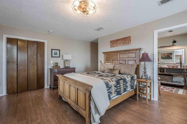 1513 S Girl Scout Rd, Amarillo, TX 79124 - bedroom with dark wood finished floors and a textured ceiling