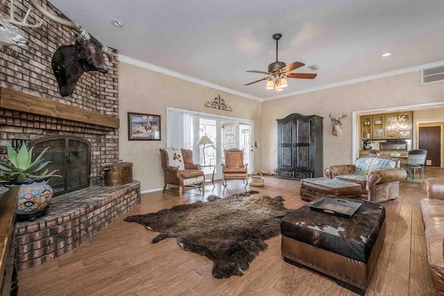 1513 S Girl Scout Rd, Amarillo, TX 79124 - living area with ceiling fan, a fireplace, wood finished floors, crown molding, and baseboards