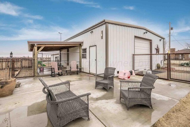 1513 S Girl Scout Rd, Amarillo, TX 79124 - view of patio / terrace with fence and a garage