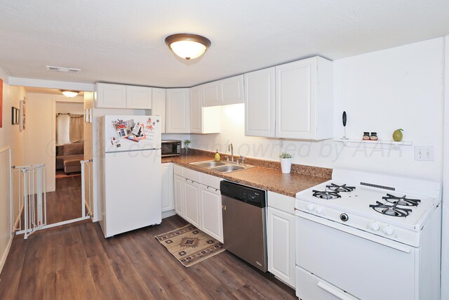 4112 S Monroe St, Amarillo, TX 79110 - kitchen with white appliances, a sink, dark wood-type flooring, and white cabinets