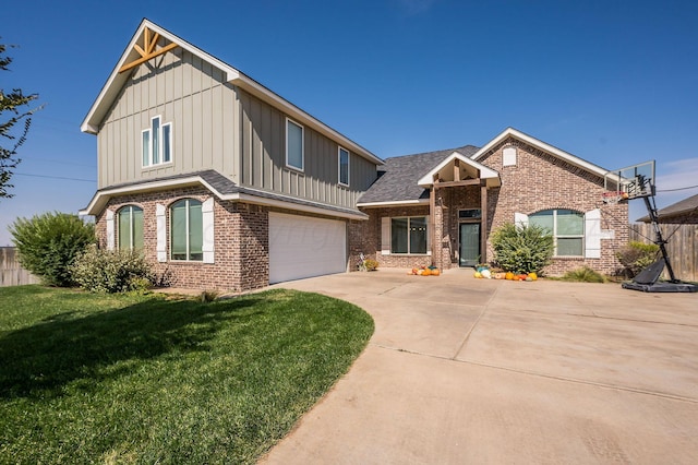 view of front facade with a garage and a front lawn