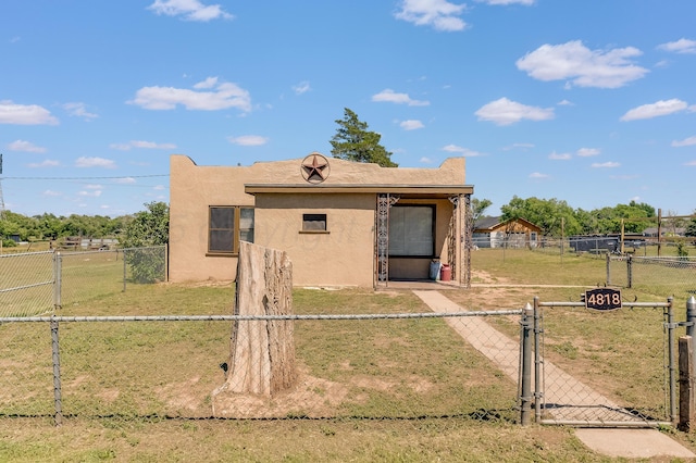 4818 Brown Ave, Amarillo, TX 79108 - view of front of home featuring a gate and stucco siding