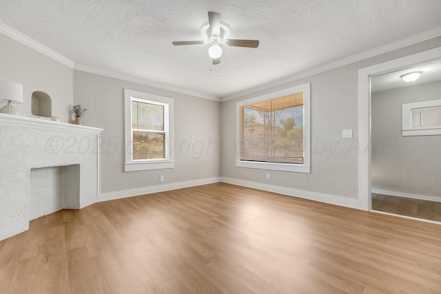 4818 Brown Ave, Amarillo, TX 79108 - unfurnished living room featuring light wood-style floors, ceiling fan, ornamental molding, a textured ceiling, and baseboards