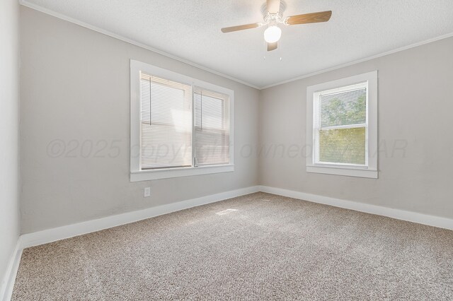 4818 Brown Ave, Amarillo, TX 79108 - carpeted empty room with ornamental molding, baseboards, a ceiling fan, and a textured ceiling