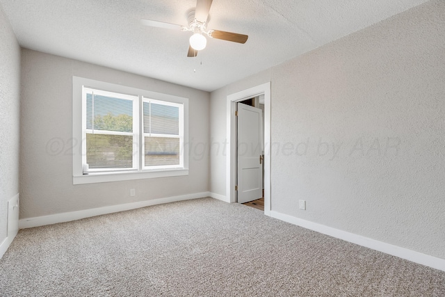 4818 Brown Ave, Amarillo, TX 79108 - unfurnished bedroom featuring carpet, baseboards, ceiling fan, and a textured ceiling