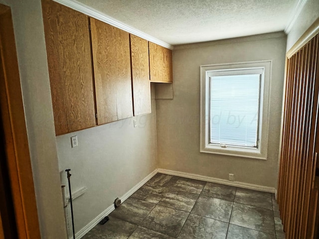 washroom with cabinets and crown molding