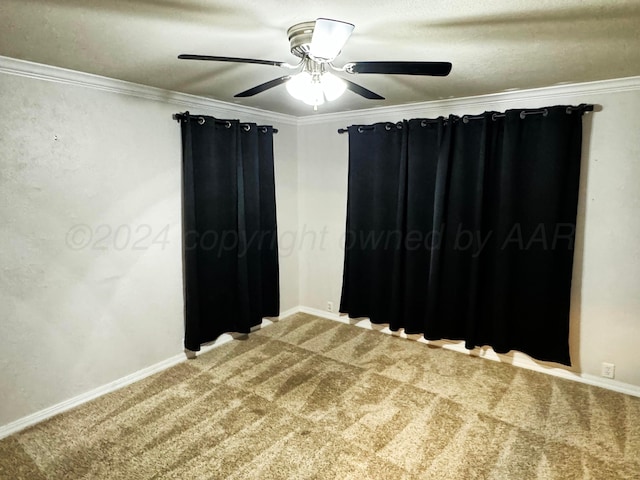 spare room with carpet flooring, ceiling fan, and crown molding