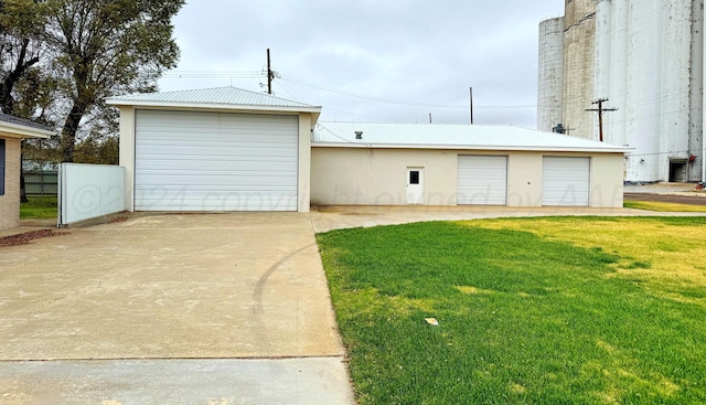 garage with a yard