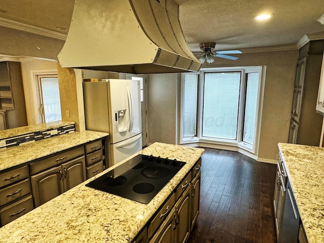 kitchen featuring dark brown cabinetry, ornamental molding, white fridge with ice dispenser, black electric stovetop, and dark hardwood / wood-style flooring