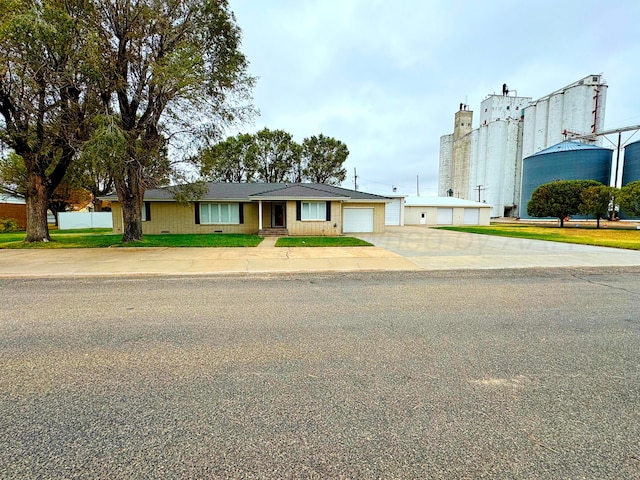 single story home featuring a garage