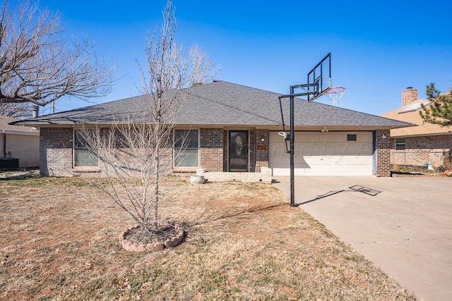 single story home featuring a garage, brick siding, driveway, and roof with shingles