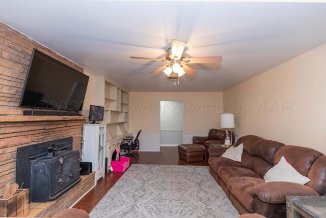6102 Calumet Rd, Amarillo, TX 79106 - living area with ceiling fan, wood finished floors, and a fireplace