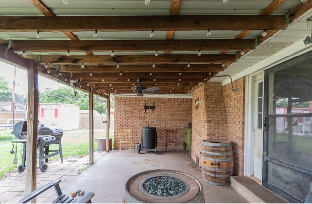 6102 Calumet Rd, Amarillo, TX 79106 - view of patio with a grill, ceiling fan, and a fire pit