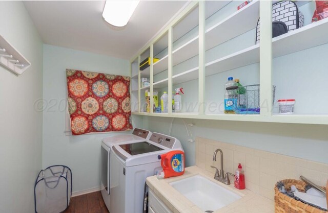 6102 Calumet Rd, Amarillo, TX 79106 - washroom featuring washing machine and clothes dryer and wood finished floors